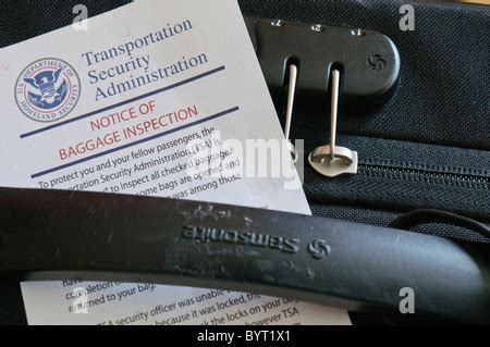 Tsa Notice Of Baggage Inspection With An Open Lock On A Suitcase Stock