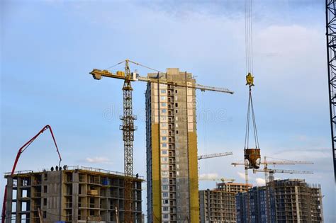 Preparing To Pour A Bucket Of Concrete Into Formworktower Crane