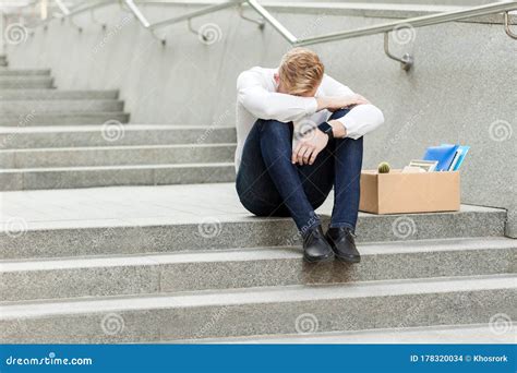 Lose Job Young Man Lost His Job Sitting On Stairs Holding Head Down