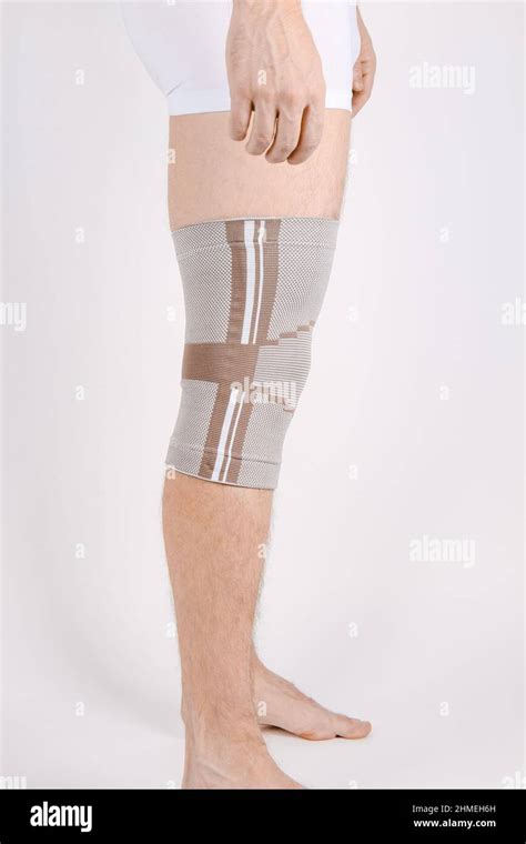 Knee Support Brace On Leg Isolated On White Background Elastic