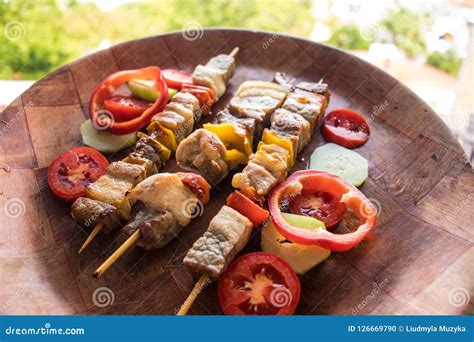 Skewered Meat Prepared On Grill With Vegetables Barbecued Shish Kebab