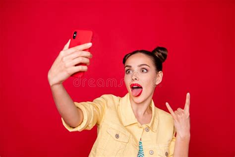 Photo Of Pretty Lady Holding Telephone Hands Making Selfies On Rock