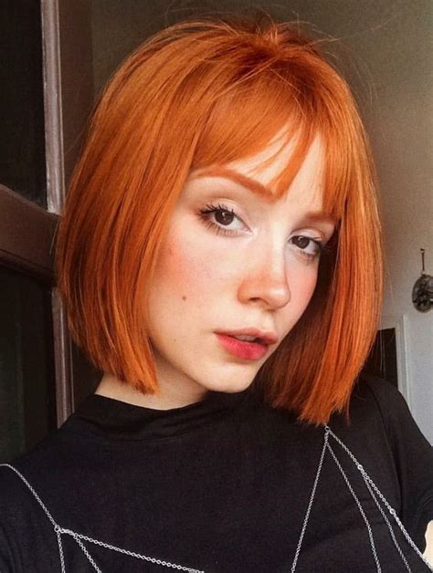 A Bold Copper Red Bob With Wispy Bangs And Curved Ends Is A Cool And