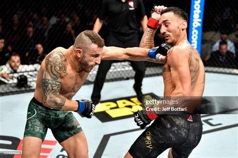 Alexander Volkanovski Of Australia Punches Max Holloway In Their Ufc News Photo Getty Images