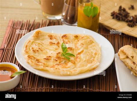 Roti Canai And Teh Tarik Very Famous Drink And Food In Malaysia Stock