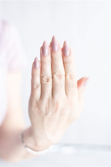 Female Hands With Light Pink Nude Nail Polish Stock Image Image Of