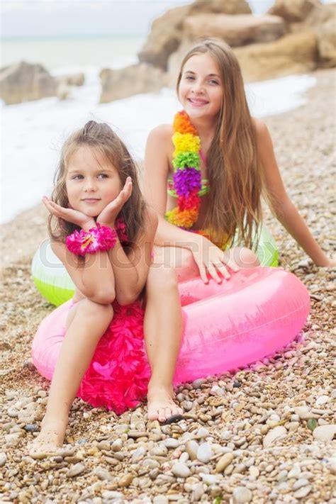 Two Pretty Smiling Sisters Are Wearing Stock Image Colourbox