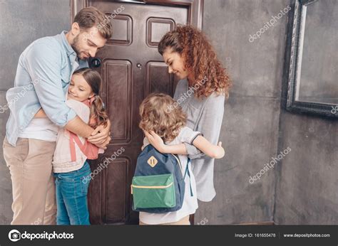 Parents hug kids before school — Stock Photo © AlexLipa #161655478