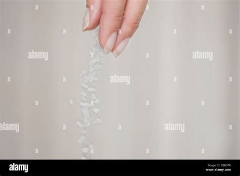 Hand Sprinkling Salt Hi Res Stock Photography And Images Alamy