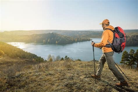 Premium Photo Man Hiker Traveling Hiking In Autumn Mountains Active