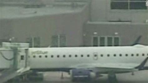 Emergency slide deploys during flight - CNN Video