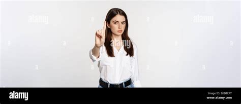 Serious Woman Showing Taboo Stop Gesture Shaking Finger In