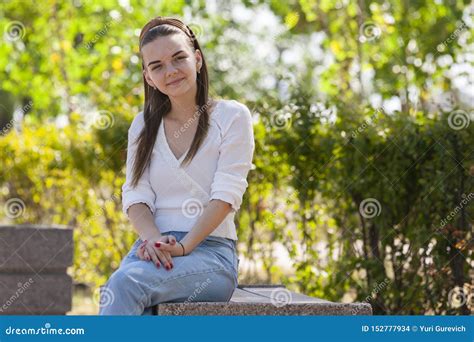 Young Beautiful Woman Sitting On Bench In Park Stock Photo Image Of