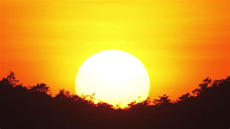 Close Up View Of Sun Setting Beyond The Horizon Stock Video