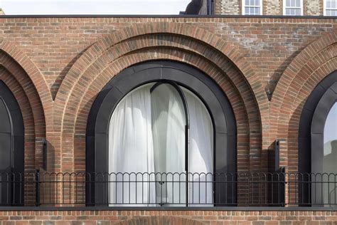 Pivoting Arched Windows Are A Unique Feature On This Row Of Townhouses