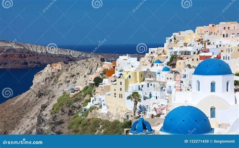 Stunning Panoramic View Of Santorini Island With White Houses And Blue