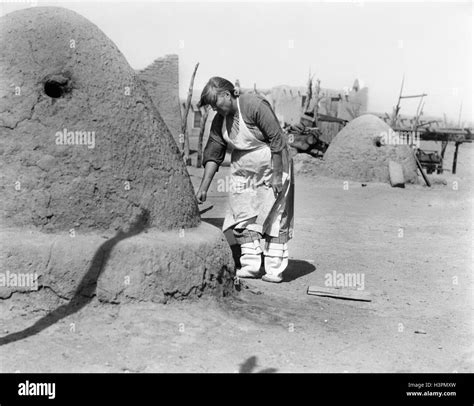 1930s Native American Indian Woman Baking Bread In Outdoor Horno Oven