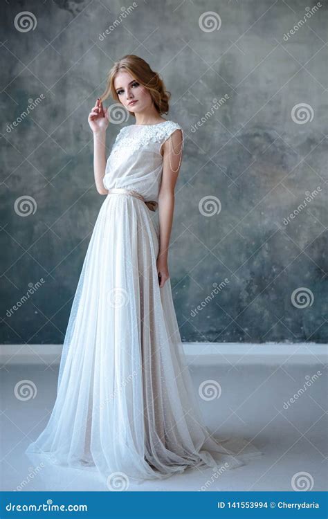 Bride Blonde Woman In A Modern Color Wedding Dress With Elegant Hair