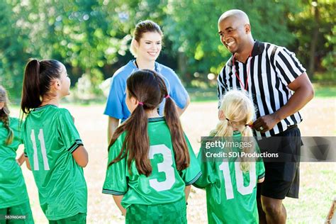 Youth Soccer Referee Explains Game Rules To Players High Res Stock