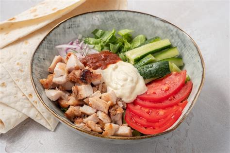 Premium Photo | Doner kebab on a plate with and salad