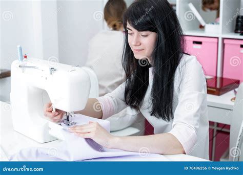 Girl Seamstress Sew On The Sewing Machine Stock Photo Image Of Adult