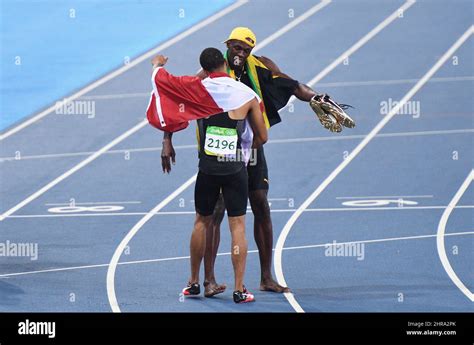 Le canadien André de Grasse à gauche et le jamaïcain Ubain Bolt