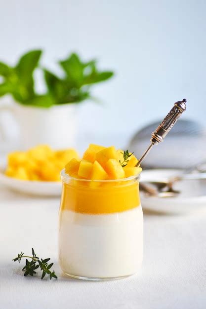 Premium Photo Italian Dessert Panna Cotta With Mango Jelly And Pieces