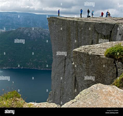 Visitors On The Preikestolen Pulpit Rock At Lysefjord Rogaland