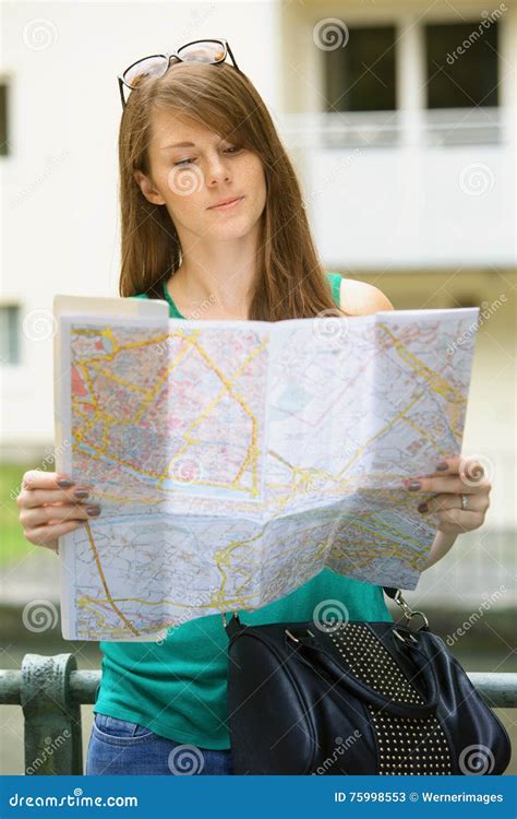 Young Woman Looking at a Street Map Stock Image - Image of luggage ...