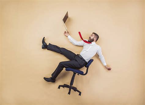 Falling Off Chair Stock Photos Pictures And Royalty Free Images Istock