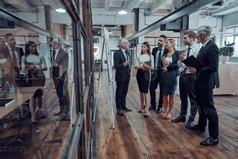 Full Length Of Modern Businessman Conducting A Presentation While