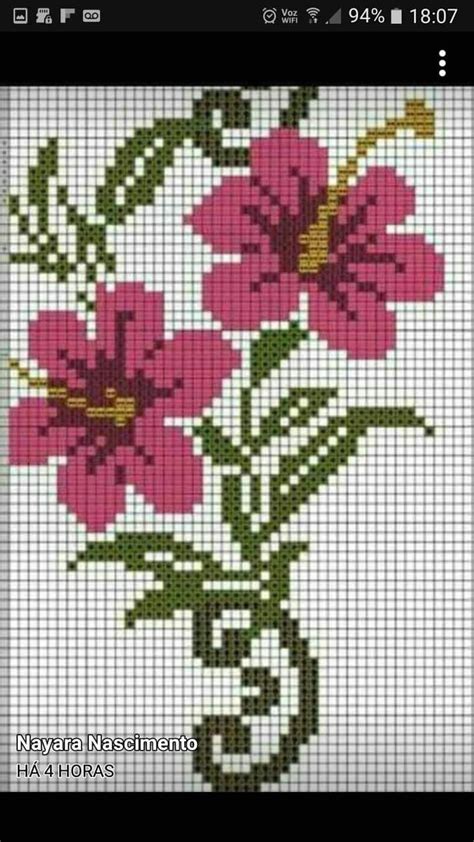 A Cross Stitch Pattern With Pink Flowers In A Vase