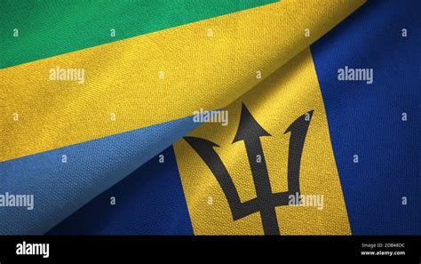 Gabon And Barbados Two Flags Textile Cloth Fabric Texture Stock Photo