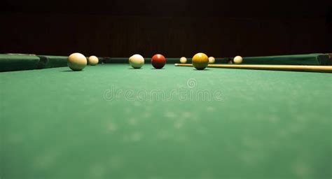 Billiard Game Colorful Balls And Cue On Green Table Stock Photo