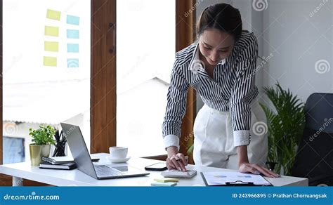 Accountant Standing and Using Calculator at Office Desk. Stock Image - Image of budget, economy ...