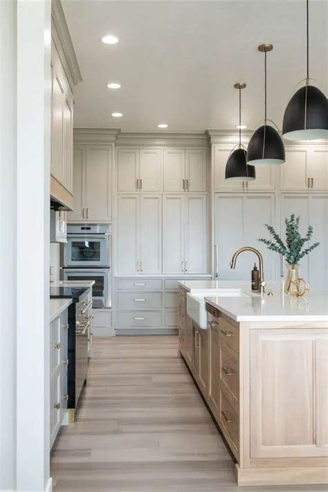 Oakstone Homes Kitchen With White Cabinets And Wooden Flooring