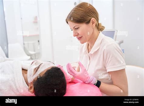 Cosmetician Performing Cosmetic Procedure On Man Skin Stock Photo Alamy