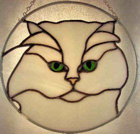 A Stained Glass Cat S Face Is Shown In Green Eyes And On A White Background