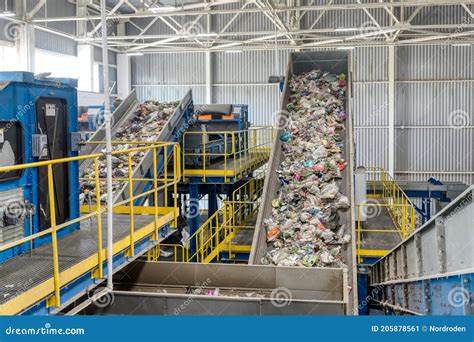 Waste Sorting And Recycling Plant Garbage Moves On A Conveyor Belt