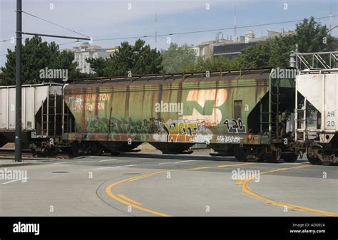 Burlington Northern Railroad freight car at grade crossing downtown ...