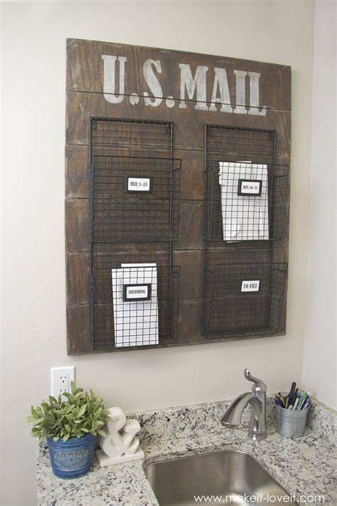 A Kitchen Sink Under A Wooden Sign That Says U S Mail