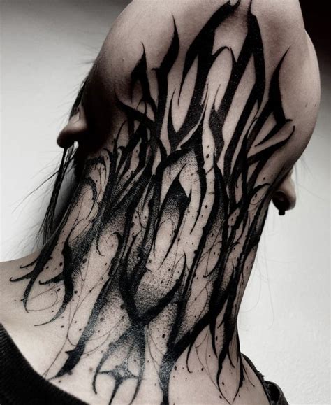 The Back Of A Person S Head With Black Ink On It