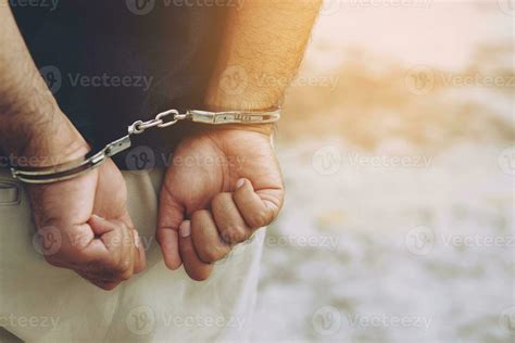 Prisoner Male Criminal Standing In Handcuffs With Hands Behind Back Banner Copy Space 24147023