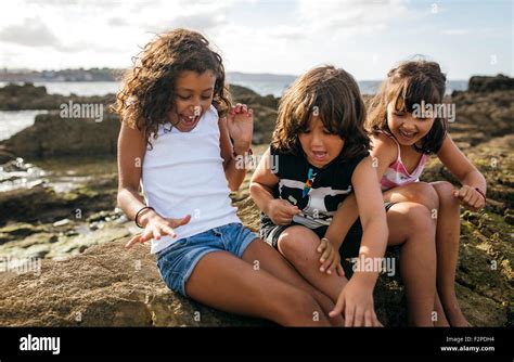 Spain Gijon Group Picture Of Three Excited Little Children Sitting At