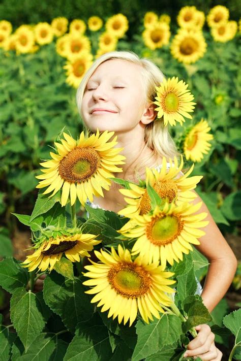 Young Girl in the Field of Sunflowers Stock Photo - Image of agriculture, beauty: 25802770