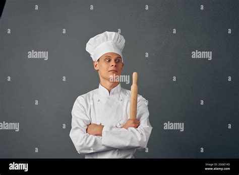 Man In Chef S Uniform Frying Pan In Hands Cooking Food Isolated