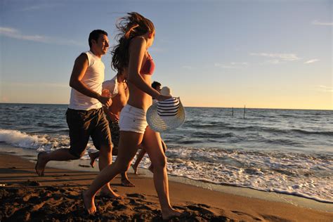 people group running on the beach 12654592 Stock Photo at Vecteezy