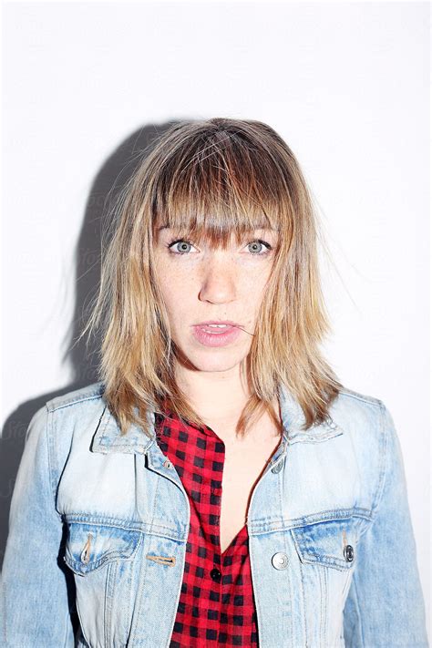 Portrait Of A Blonde Woman With Freckles And Green Eyes By Stocksy