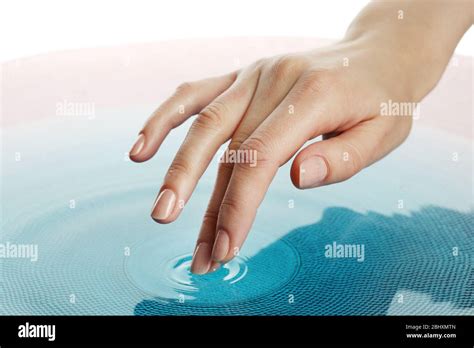 Finger Touches Water Close Up Stock Photo Alamy