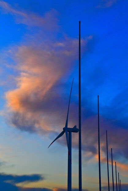 Premium Photo Low Angle View Of Wind Turbine Against Dramatic Sky